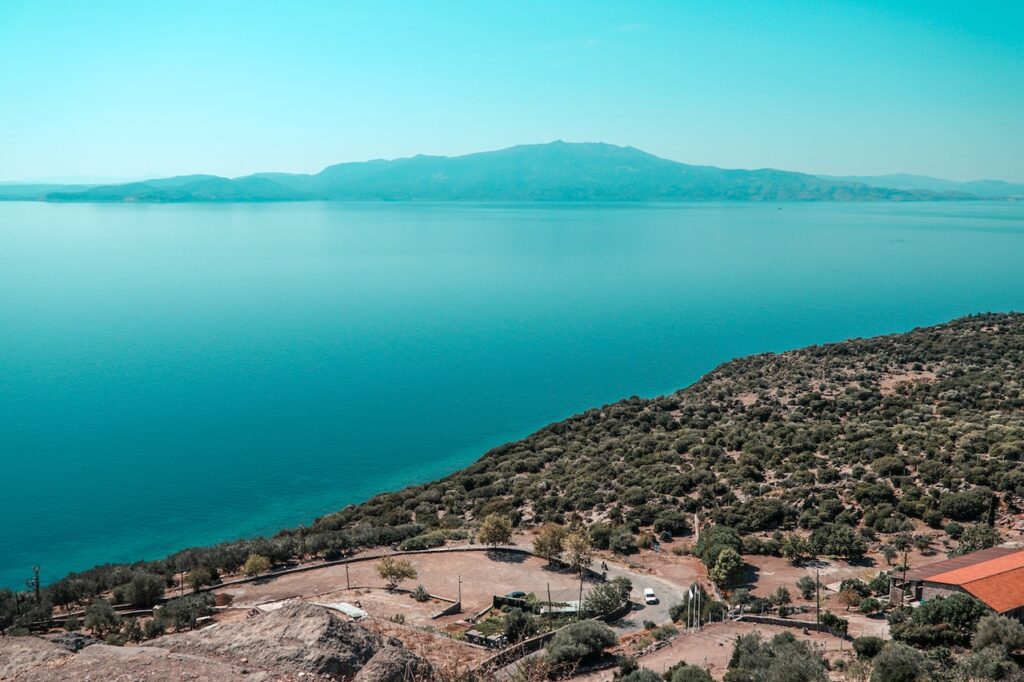 Photo by Mert Kahveci: https://www.pexels.com/photo/birds-eye-view-of-the-coastline-at-assos-8011511/